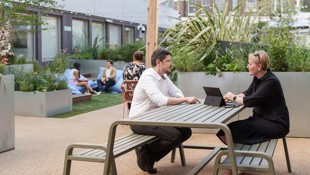 Image of two people at Elm Yard terrace